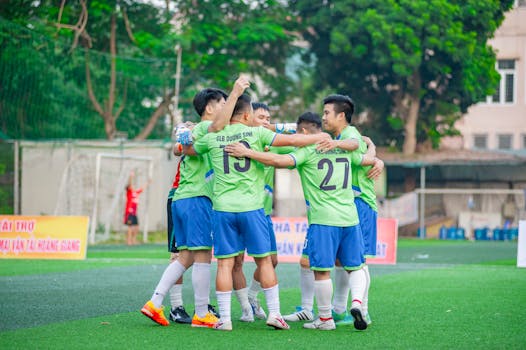 youth soccer players celebrating a goal